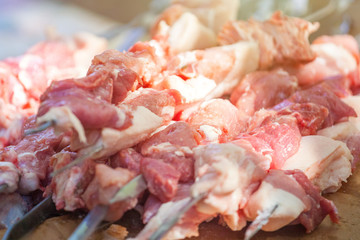 fresh raw fillet steak red meat on skewers barbecue