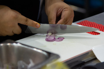 Fototapeta na wymiar chopping garlic on wooden board for cooking