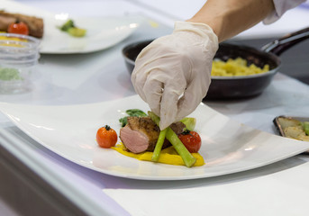 Chef preparing food, meal, in the kitchen, chef cooking, Chef decorating dish, closeup, .chef at work.
