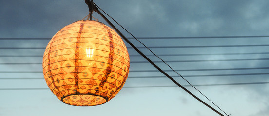 Chinese lamp illuminating restaurant