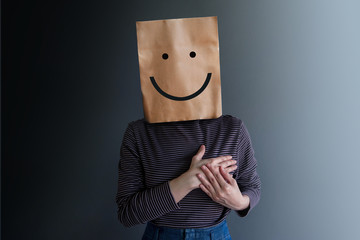 Customer Experience or Human Emotional Concept. Woman Covered her Face by Paper Bag and present...