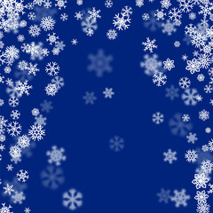 Christmas snow background with scattered snowflakes falling in winter