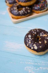Baked chocolate doughnuts with chocolate glaze. toning. selective focus