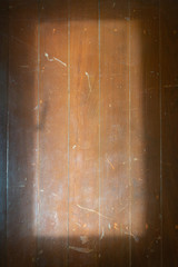 top view of wooden floor with sunlight and shadow from outdoor window.