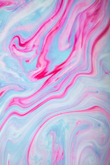 Abstract colored background. Stains of paint on the water. Ebru art, marbled paper.