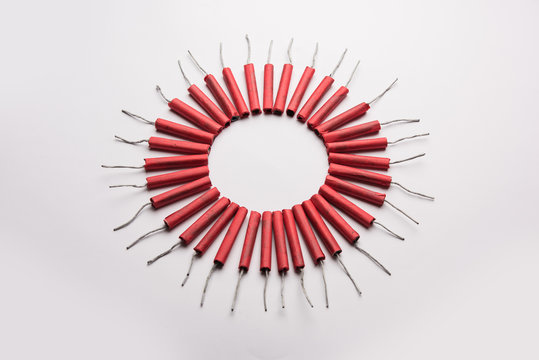 Diwali Firecrackers along with Clay oil lamp or Diya arranged over white background to create a beautiful rangoli or design