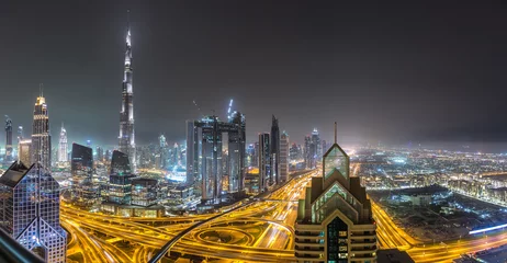 Tuinposter Downtown Dubai at night © Sergii Figurnyi