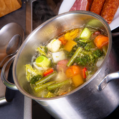 delicious autumnal vegetable soup with sausage and bacon