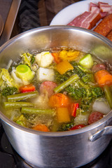delicious autumnal vegetable soup with sausage and bacon