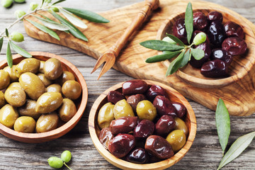 Bowls with different marinated olives. Healthy snack or appetizer.
