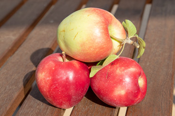 red apples on wooden table