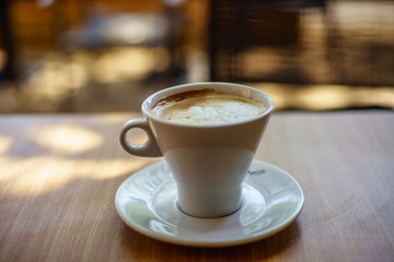 Latte Macchiato on wooden table