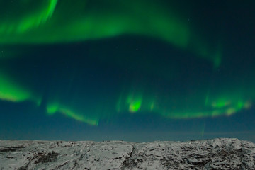 Aurora, northern lights, night, tundra in winter.