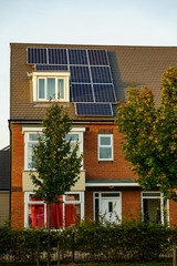 English House with Solar Panels on roof for electisity