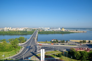 Fototapeta premium Nizhny Novgorod, Russia - August 19, 2018: Summer view of the Arrow - the confluence of the Oka and Volga rivers and Kanavinsky bridge over the Oka river 
