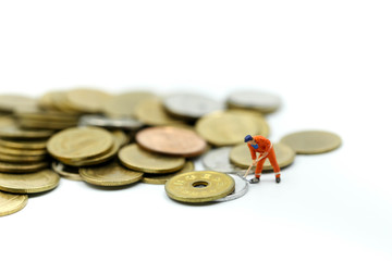 Miniature people : worker digging on coins ,Money, Financial, Business Growth concept.