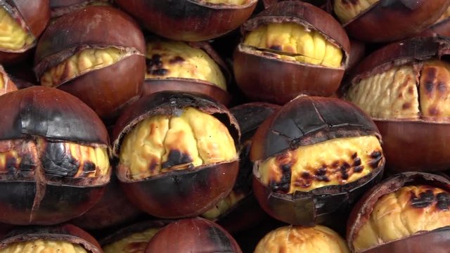 Roasted chestnuts, outdoor. Seasonal dried fruits in autumn