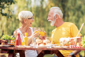 Romantic senior couple having lunch outdoors