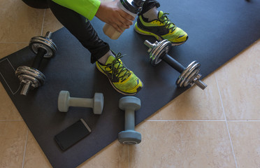 Dumbbell and mat training at home,