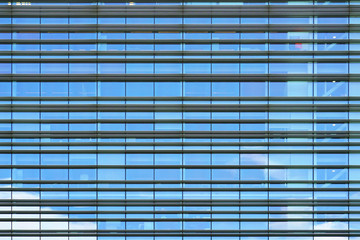 Fototapeta na wymiar Glass grey square Windows of modern city business building skyscraper. Modern apartment buildings in new neighborhood. Windows of a building, texture.