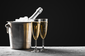 glasses of champagne with a champagne bottle in a bucket