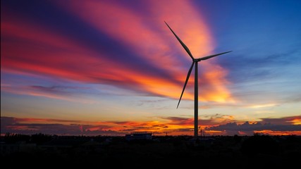 Silhouettes Wind turbine power generators at sunset, Alternative renewable energy production, Large wind turbine for electric