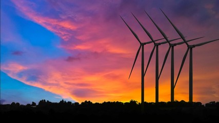 Silhouettes Wind turbine power generators at sunset, Alternative renewable energy production, Large...