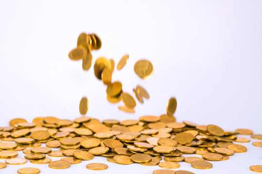 Movement of falling gold coin, flying coin, rain money with soft shadow on white background, business and financial wealth and take profit concept.