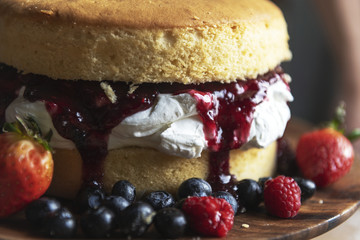 Closeup of a layered cake with berries