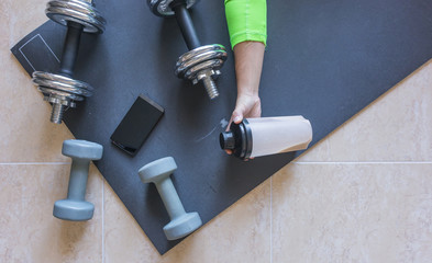 Dumbbell and mat training at home,