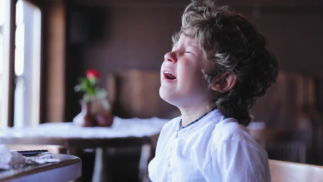Boy Crying. Upset Little Child Cry At Cafe