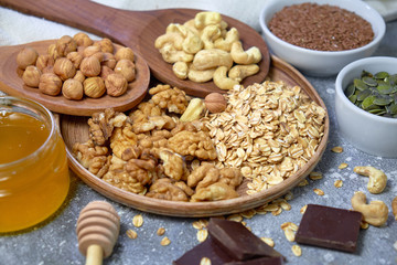 Various nuts on stone table. Top view with copy space
