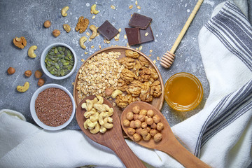 Various nuts on stone table. Top view with copy space