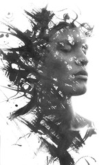 Paintography. Double exposure of an attractive model combined with hand drawn ink paintings with...