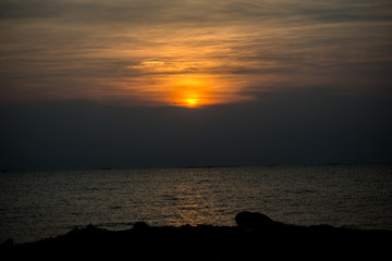 Beautiful sunset with aura at the beach, romantic twilight time, scenery feeling. Happiness long holidays. Nature background for wallpaper, copy space