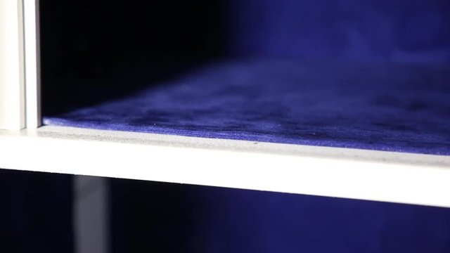 Safe inside. View of internal section of the safe. The cell is covered with special velvety soft material. It is partially visible an external part of the safe.