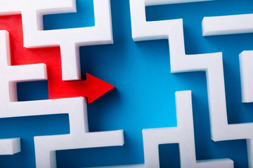 Red Arrow At The Center Of White Maze