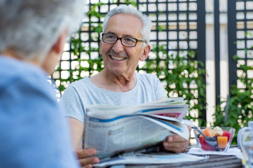 Senior man holding newspaper