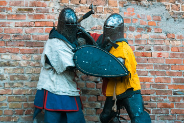 Fototapeta na wymiar Fight, the struggle of medieval knights in armor.