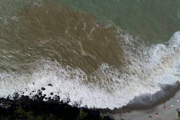 Storm and vacationers on the Black Sea coast.