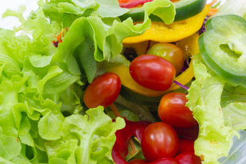 Close up A green salad is a dish consisting of a mixture of small usually vegetables 