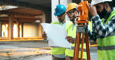 Fototapeta na wymiar Portrait of construction engineers working on building site