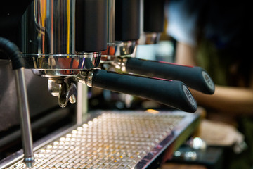 Barista working in a coffee shop, Close up of barista presses ground coffee using tamper, Barista Make Coffee Portafilter Concept