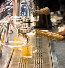espresso shot from coffee machine in coffee shop,Coffee maker in coffee shop
