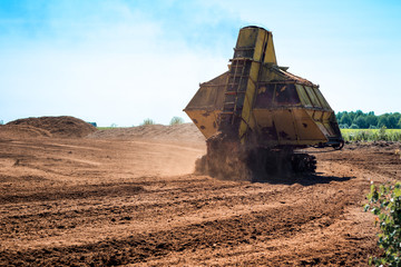 Obraz premium Special machine for peat extraction. Peat harvester. Agriculture industry, peat farm