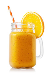 Smoothies made from ripe orange in glass jar isolated on white background