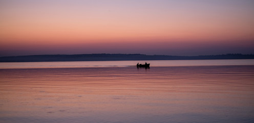sunset , boat in the lake
