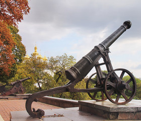 Old cannons on the background of the church