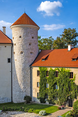 Pieskowa Skala, Poland - Inner courtyard and gothic tower of historic castle Pieskowa Skala by the Pradnik river in the Ojcowski National Park