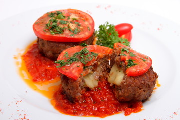 cutlet with cheese and tomatoes